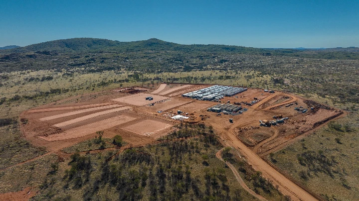 Arafura Rare Earths: Australia’s Bid to Break China’s Grip

Every day, tonnes of rare earths leave Australia — never to be seen again. They’re refined in China, built into electric vehicles, wind turbines, and even fighter jets. For decades, it’s been the same story: we dig it up, they refine it, and the real value is captured offshore.

But in the red heart of the Northern Territory, that balance is starting to shift.

The Nolans Project: A New Chapter for Australian Processing

Just north of Alice Springs, Arafura Rare Earths is building something unprecedented — the Nolans Project, a combined mine and refinery designed to process neodymium and praseodymium (NdPr) right here at home. These are the critical elements that power electric vehicle motors, defence systems, and clean energy technologies.

Backed by over $1 billion in funding, including support from the Australian and Northern Territory governments, Arafura’s project aims to change how Australia participates in the global rare earths supply chain. Instead of exporting raw ore for someone else to refine, the Nolans Project will do the refining itself — keeping more value and jobs in Australia.

Cutting Beijing’s Ties

China currently dominates the global rare earth market, refining over 80% of the world’s supply. This control gives Beijing enormous influence over global technology and defence industries.
Now, the U.S. is taking notice — and investing. Washington wants to diversify its supply chains away from China, and Arafura’s project fits perfectly into that plan. It’s part of a growing strategic alignment between Canberra and Washington, focused on resource security and economic resilience.

More Than a Mine — A Strategic Move

The Nolans Project isn’t just about mining — it’s about reshaping Australia’s economic sovereignty. Every tonne refined locally strengthens our position in global supply chains, attracts international partners, and builds regional jobs in Central Australia.

If successful, Arafura could pave the way for a new generation of processing and manufacturing onshore — one where we don’t just export dirt, but high-value materials powering the world’s next wave of technology.

Could this be the start of something new?